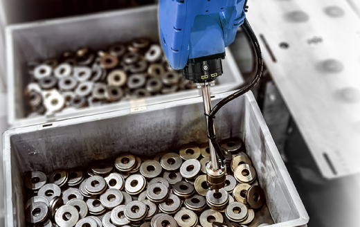 artificially intelligent machine selecting metal pieces from a bin