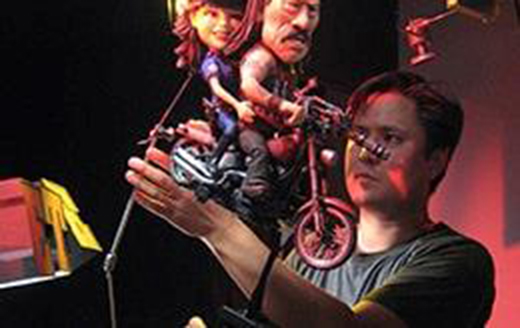 Webster Colcord tweaking claymation figures for filming