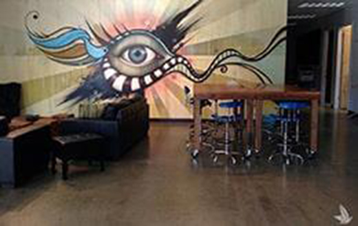 waiting room with mural of an eye on one wall
