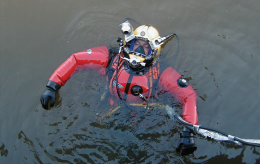 Brian Abbott floating on top of water in scuba diving gear